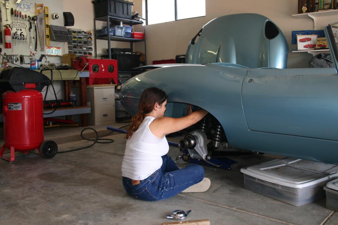 Daughter-in-law helping with rear suspension - This is just after getting the rear suspension installed in my EType.  Daughter in law helping tighten the fittings