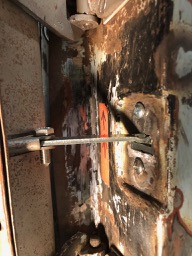passenger door strap mount repaired.jpg