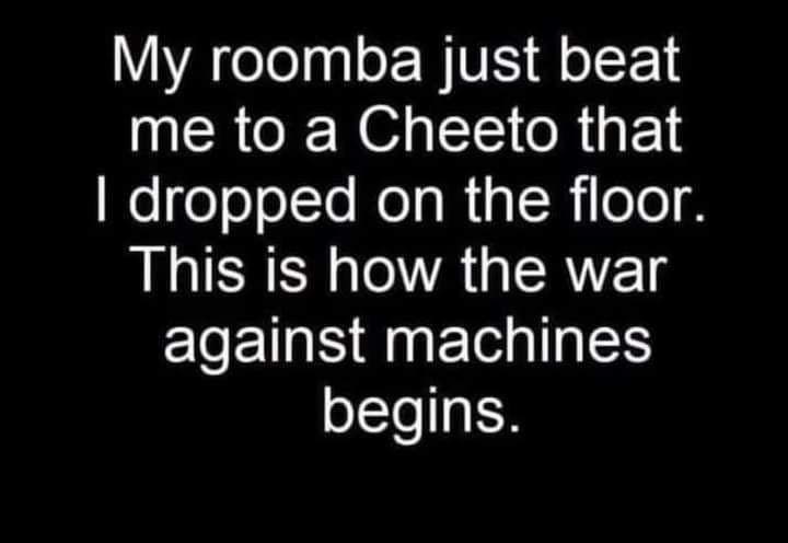 Roomba beats me to Cheeto.jpg