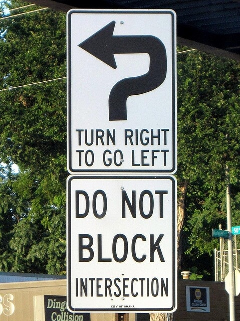 turn-right-to-go-left-road-sign.jpg