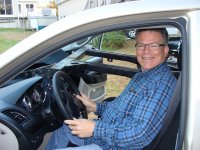 Chris in the van with frame.jpg