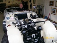 My `57TR3 being looked at by my Friend & Guru Mechanic FRED THOMAS.  He approves..jpg