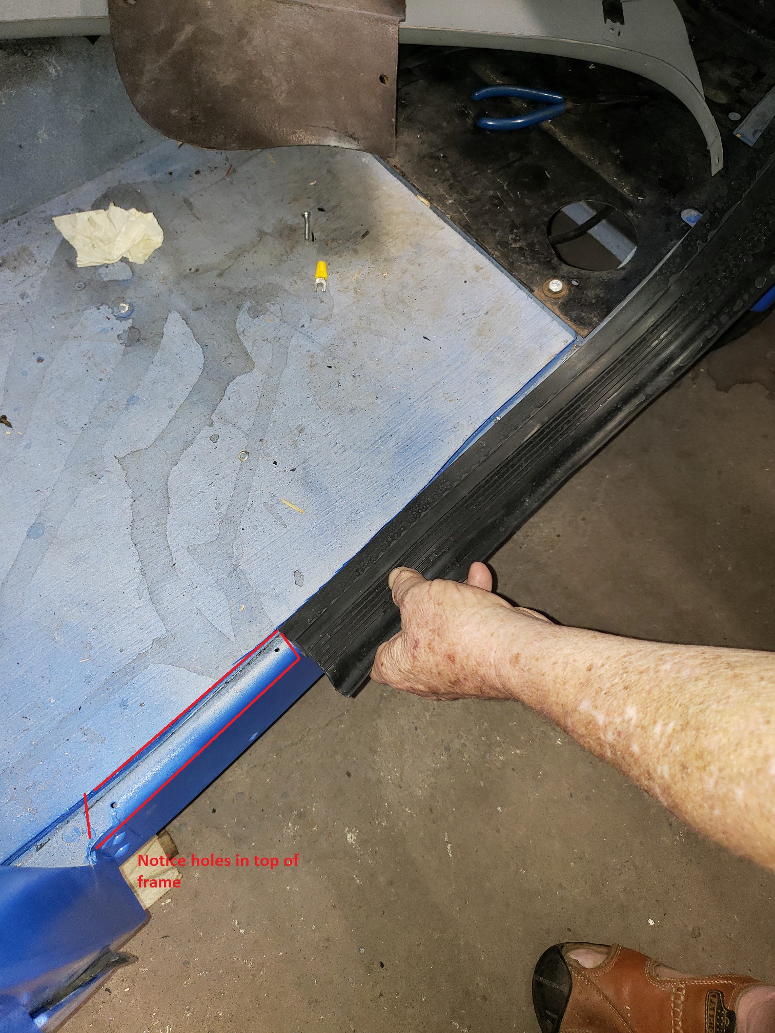 Door bottom Weatherstrip frame holes 1.jpg