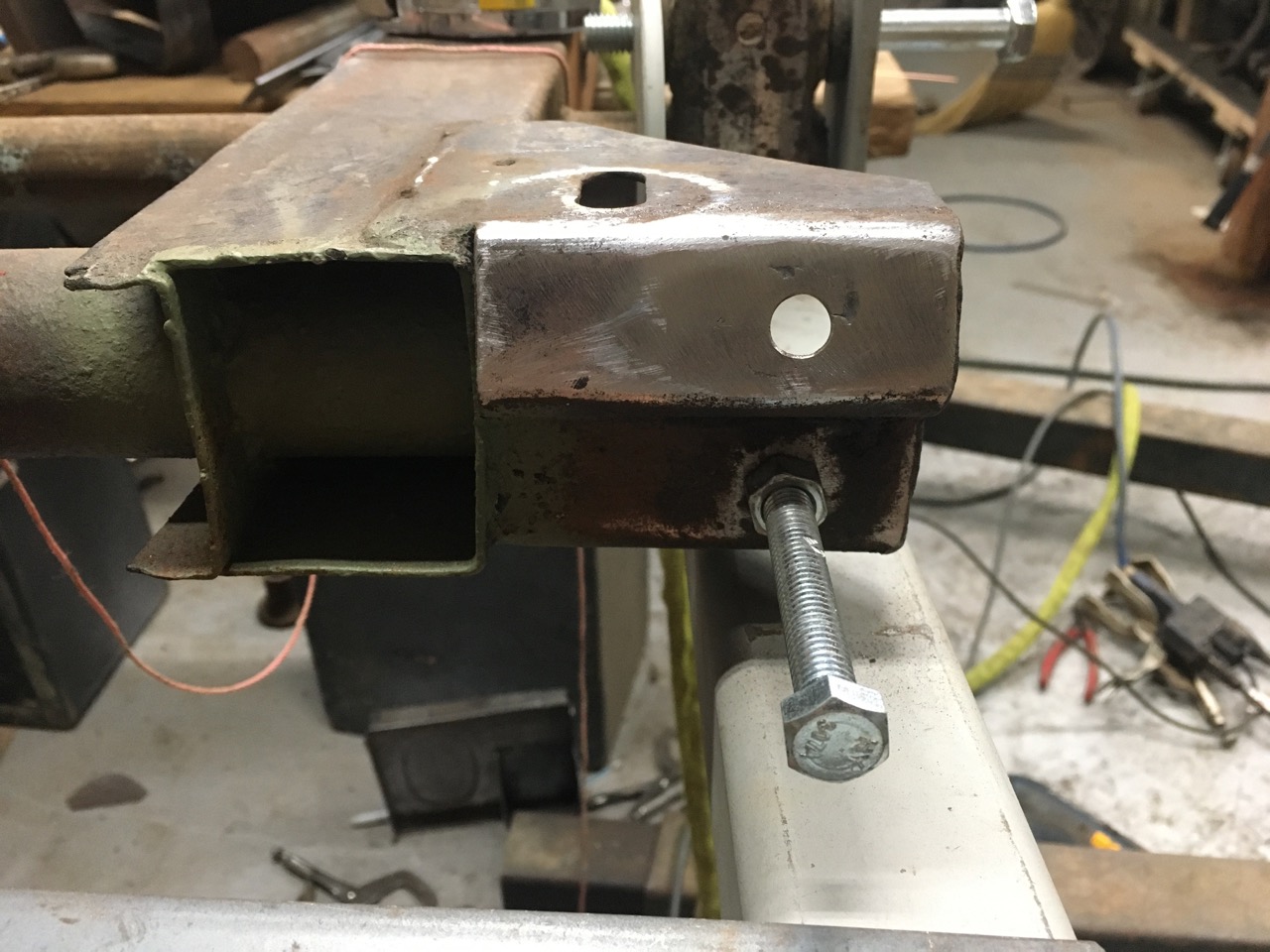 Passenger side distance tube hole after repair.jpg